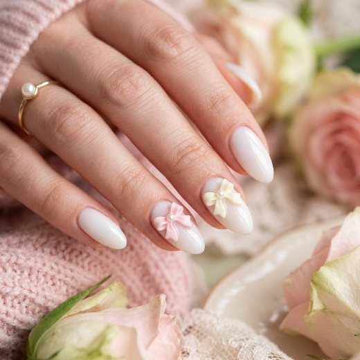Milky white manicure with bow