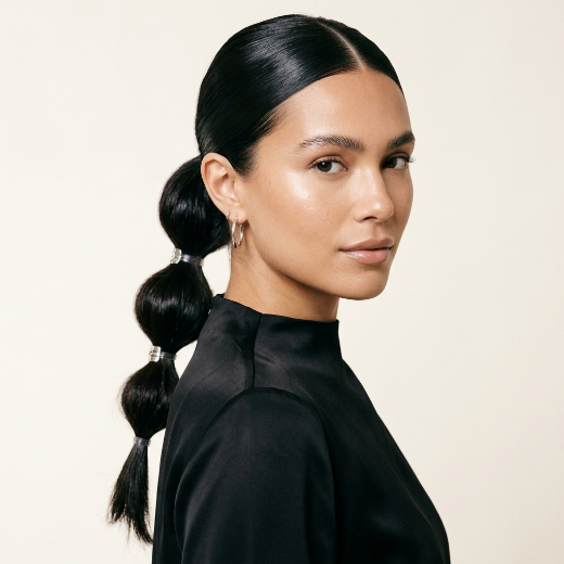 Sleek middle-part hairstyle